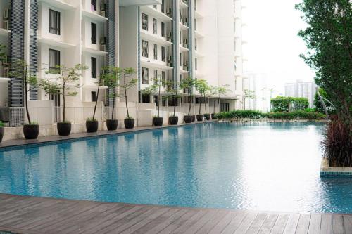 a large swimming pool in the middle of a building at Cyberjaya HOMEstay With Playground Slide - 5 Pax in Gua Sai