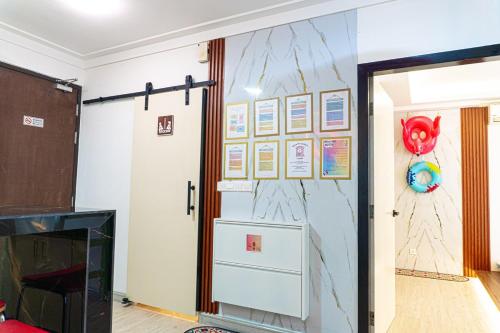 a room with a wall with a painting on it at Cyberjaya HOMEstay With Playground Slide - 5 Pax in Gua Sai
