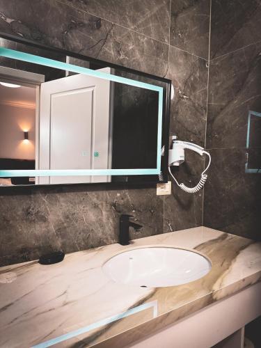 a bathroom with a sink and a mirror at Blumoon Holiday in Golem