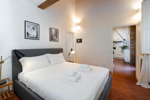 Postel nebo postele na pokoji v ubytování Porta Romana - Cozy Apartment