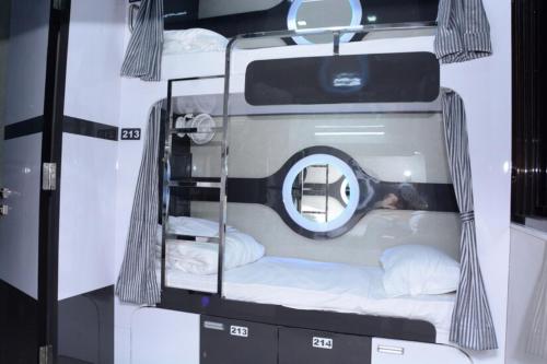 a room with two bunk beds in a trailer at O C E A N Dormitory T-2 in Mumbai
