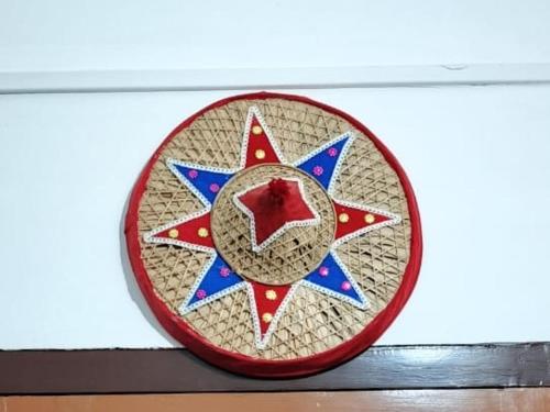 a plate with a star on it on a shelf at Rudra Homes in Lokpriya Gopinath Bordoloi International
