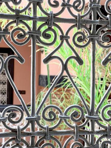 a close up of a black metal gate at Riad Musa in Marrakech