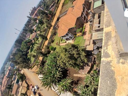 an overhead view of a building with trees on a beach at Residence Next Door Green Zone in Kiambu