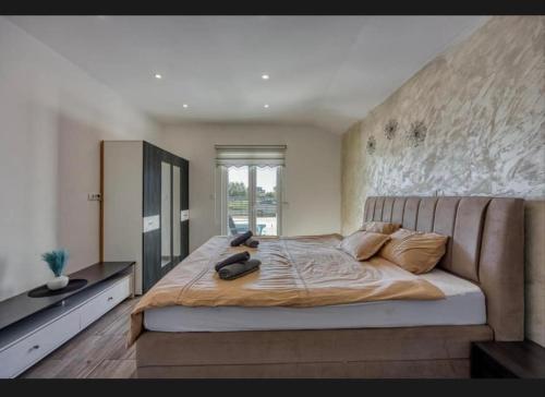 a large bedroom with a large bed with a large at Vila Didi in Fažana