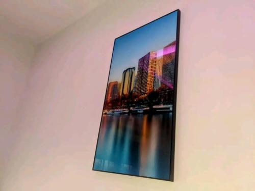 a picture of a city on the wall at Studio climé meublé a cotonou in Godomey