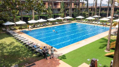 an overhead view of a swimming pool at a hotel at Kabira Country Club in Kampala