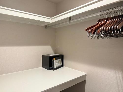 a kitchen with a white counter with wine glasses at Kyohotel Kishotei Goshominami in Kyoto