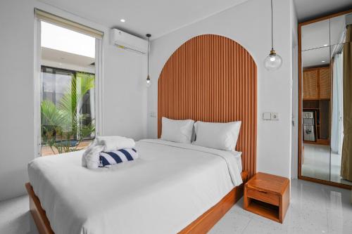 Giường trong phòng chung tại Oasis Villa Seminyak