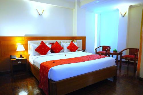 Katil atau katil-katil dalam bilik di Hotel Holy Himalaya