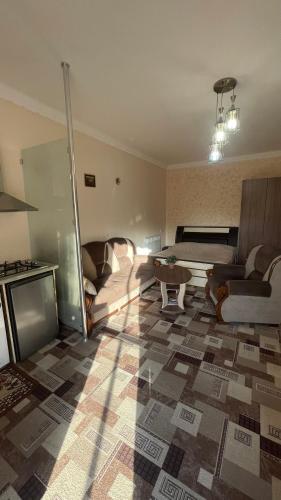 a living room with a couch and a table at Norik guest house in Garni
