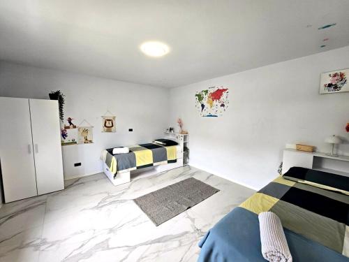 a bedroom with two beds in a room at Rozna Retreat in Nova Gorica