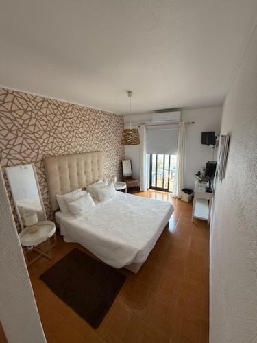 Postel nebo postele na pokoji v ubytování Vivenda Rosa Lagos