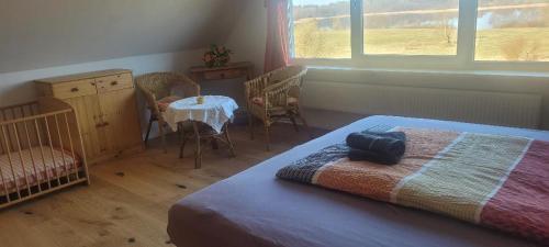 Ένα ή περισσότερα κρεβάτια σε δωμάτιο στο Ferienhaus am See