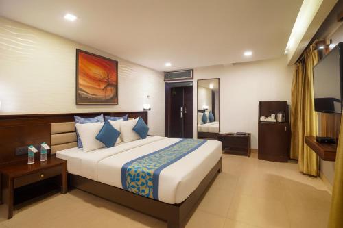 Postel nebo postele na pokoji v ubytování Hotel Horizon - Near Fateh Sagar Lake Udaipur