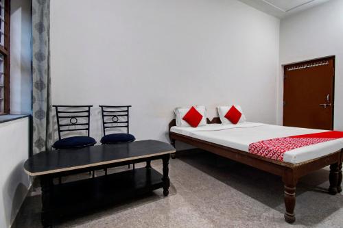 Ένα ή περισσότερα κρεβάτια σε δωμάτιο στο Hotel O Vishal