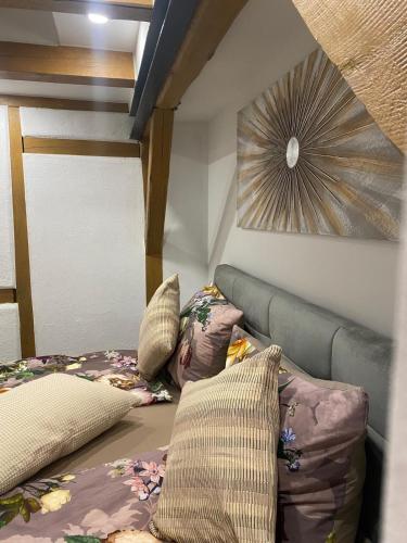 a bedroom with a bed and pillows on it at A7 J22 FeWo Michelangelo NETFLIX Fußgängerzone in Eisenach