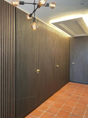 a room with a wall of wood panels and a ceiling at A Design Casa in Own Private Hills for Adult Only in Alginet