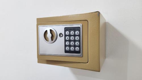 a switch with a remote control on a wall at Rich Bar & House in Pattaya
