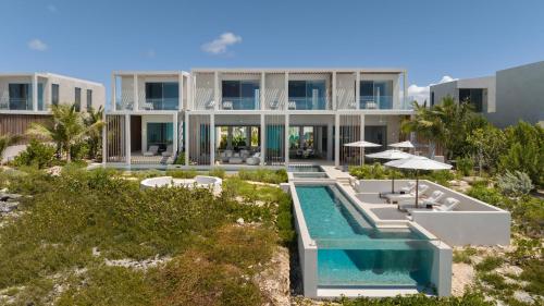 an aerial view of a villa with a swimming pool at South Bank in Long Bay Hills