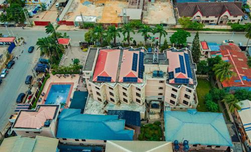 an overhead view of a building with blue roofs at Dees Hotels Apartments And Suites in Lagos