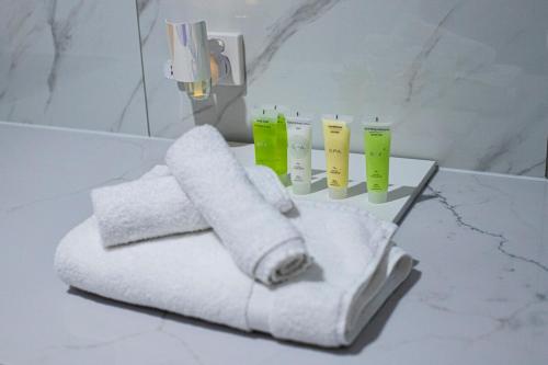 a towel holder with toilet paper on a counter in a bathroom at Pool, Games & fun - Family Retreat! in Boronia