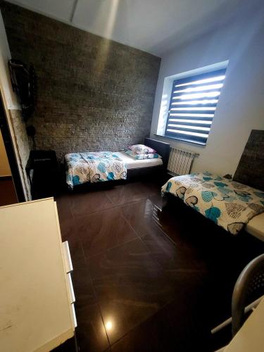Postel nebo postele na pokoji v ubytování M Hostel