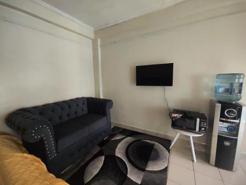 Truenest spacious Studioにあるテレビまたはエンターテインメントセンター