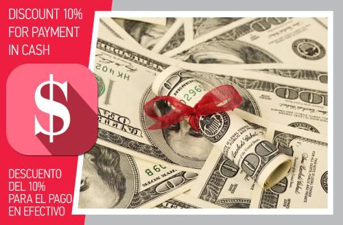 a bunch of dollar bills with a red bow at CAMPO DEL MAR - STUDIOS and SUITES - LOS CORALES beach in Punta Cana