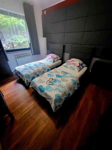 Postel nebo postele na pokoji v ubytování M Hostel
