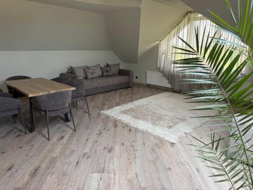 a living room with a couch and a table at Lauras in Bauska