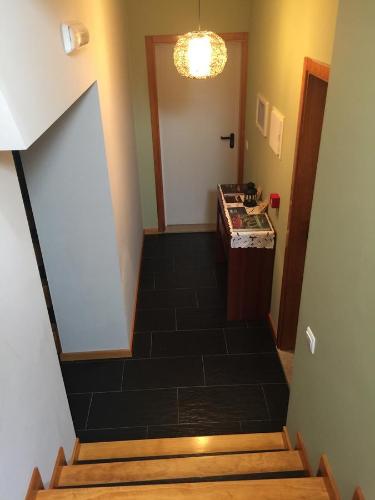 a hallway with a staircase leading up to a room at Casas do Terreiro in Seia