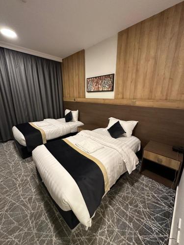 Postel nebo postele na pokoji v ubytování Sudair Karam Hotel - فندق سدير كرم