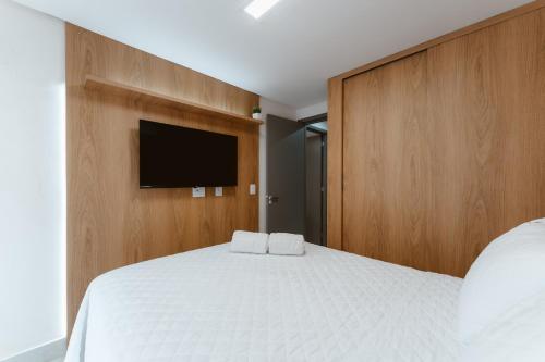 Katil atau katil-katil dalam bilik di Jardins Almare Apart Hotel
