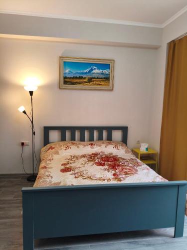 a bedroom with a bed with blood on it at Alvina 2 apartment hotel in Tsaghkadzor