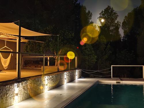 a swimming pool at night with balloons around it at A Design Casa in Own Private Hills for Adult Only in Alginet