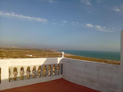 a balcony with a view of the ocean at Maison Fatima in Essaouira