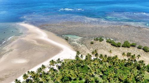 an aerial view of a heart shaped island in the ocean at Casinha Azul in Ilha de Boipeba