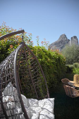 a basket filled with plants in a garden at Villa Under Meteora in Kalabaka