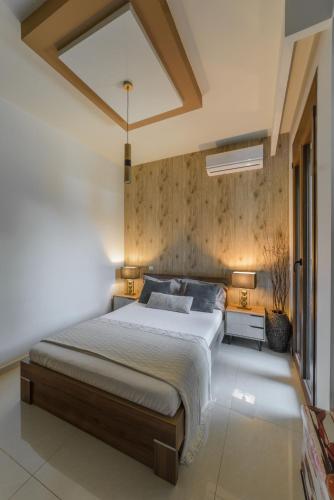 a bedroom with a large bed in a room at Villa Under Meteora in Kalabaka