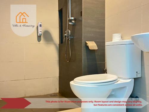 a bathroom with a toilet and a sink at IdamanKu Comfort Studio - Cybersquare SOHO Cyberjaya in Cyberjaya