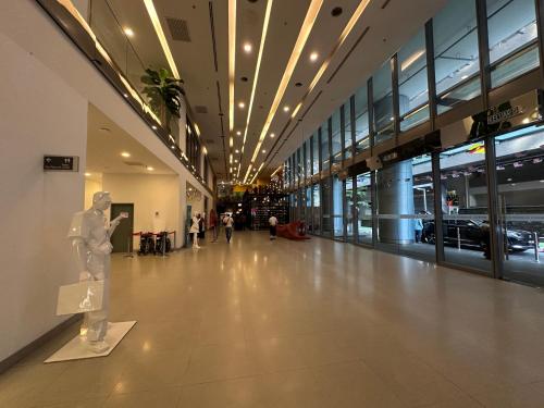 a building with a statue in the middle of a hallway at Summer Suites KLCC BY Lotus in Kuala Lumpur