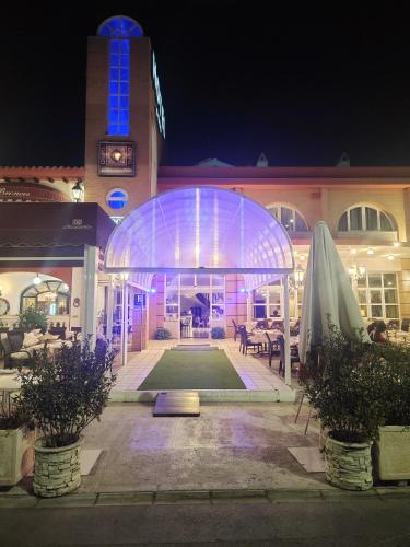 a large building with a lit up facade at night at Los Bronces in Lucena