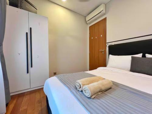 Ένα ή περισσότερα κρεβάτια σε δωμάτιο στο Sky Suites KLCC City View