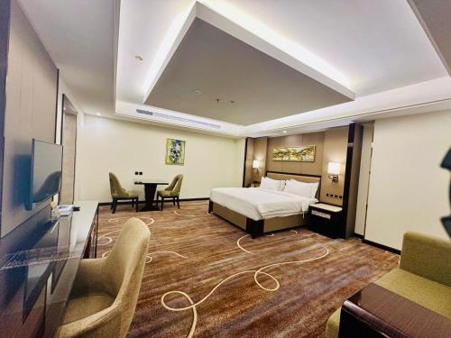 Al Ertiqaa Hotelにあるベッド