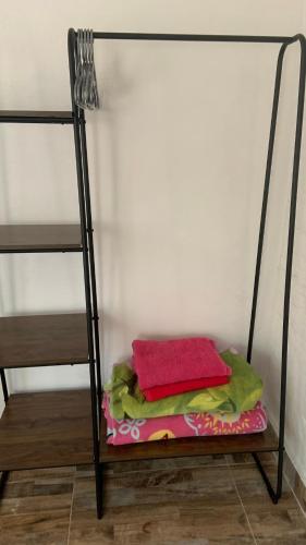 a shelf in a room with two bunk beds at habitaciones ecopolis en el queremal in El Queremal