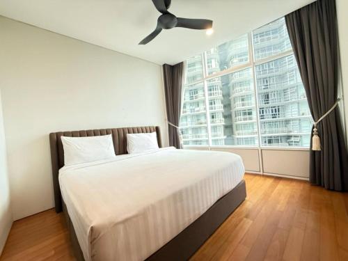 Ένα ή περισσότερα κρεβάτια σε δωμάτιο στο Sky Suites KLCC City View