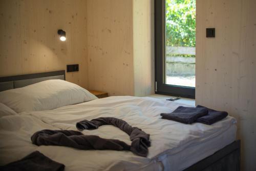 Postel nebo postele na pokoji v ubytování Resort Krásná Morava - moderní ubytování pár minut od centra Olomouce