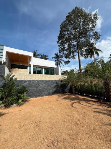 a house with a tree on the side of it at Villa Thai Sabai 2, Lamai in Lamai