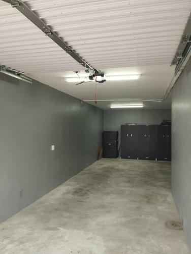 an empty room with a ceiling fan in a garage at Atlantic Dunes No 14 in Walvis Bay